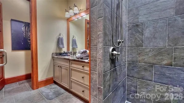 a bathroom with a bathtub and a shower
