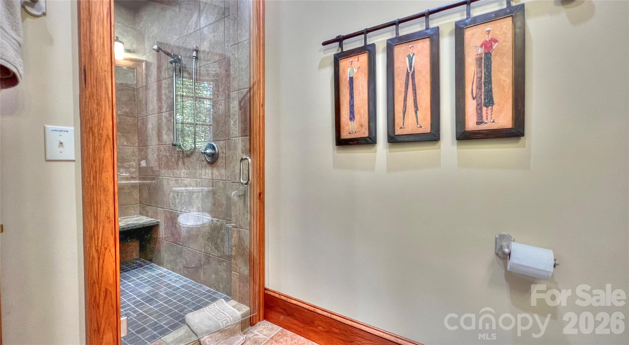 538 Chestertown Drive Mill Spring, NC 28756 - Photo 41 of 48 a bathroom with a glass shower door