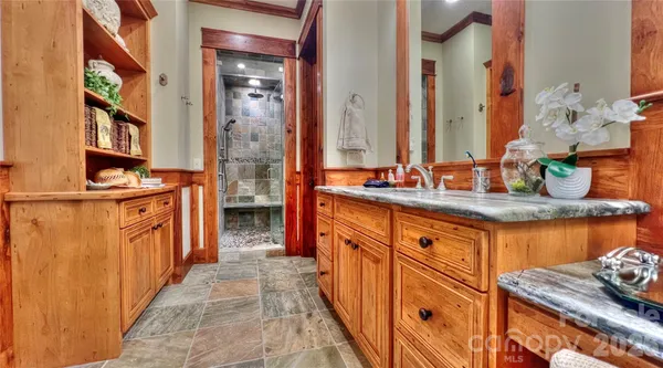 a picture of a bathroom with a shower