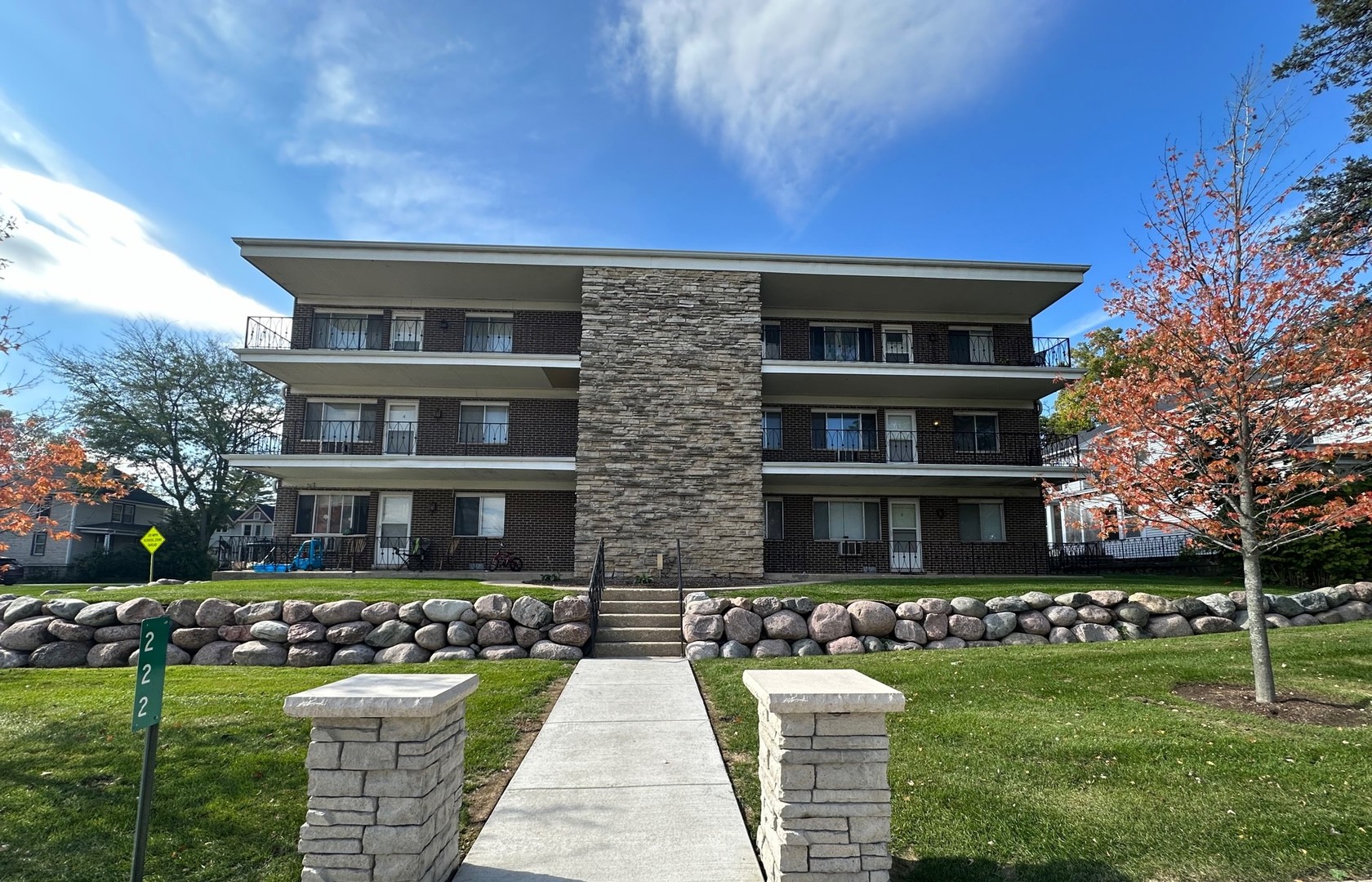 a front view of building with yard