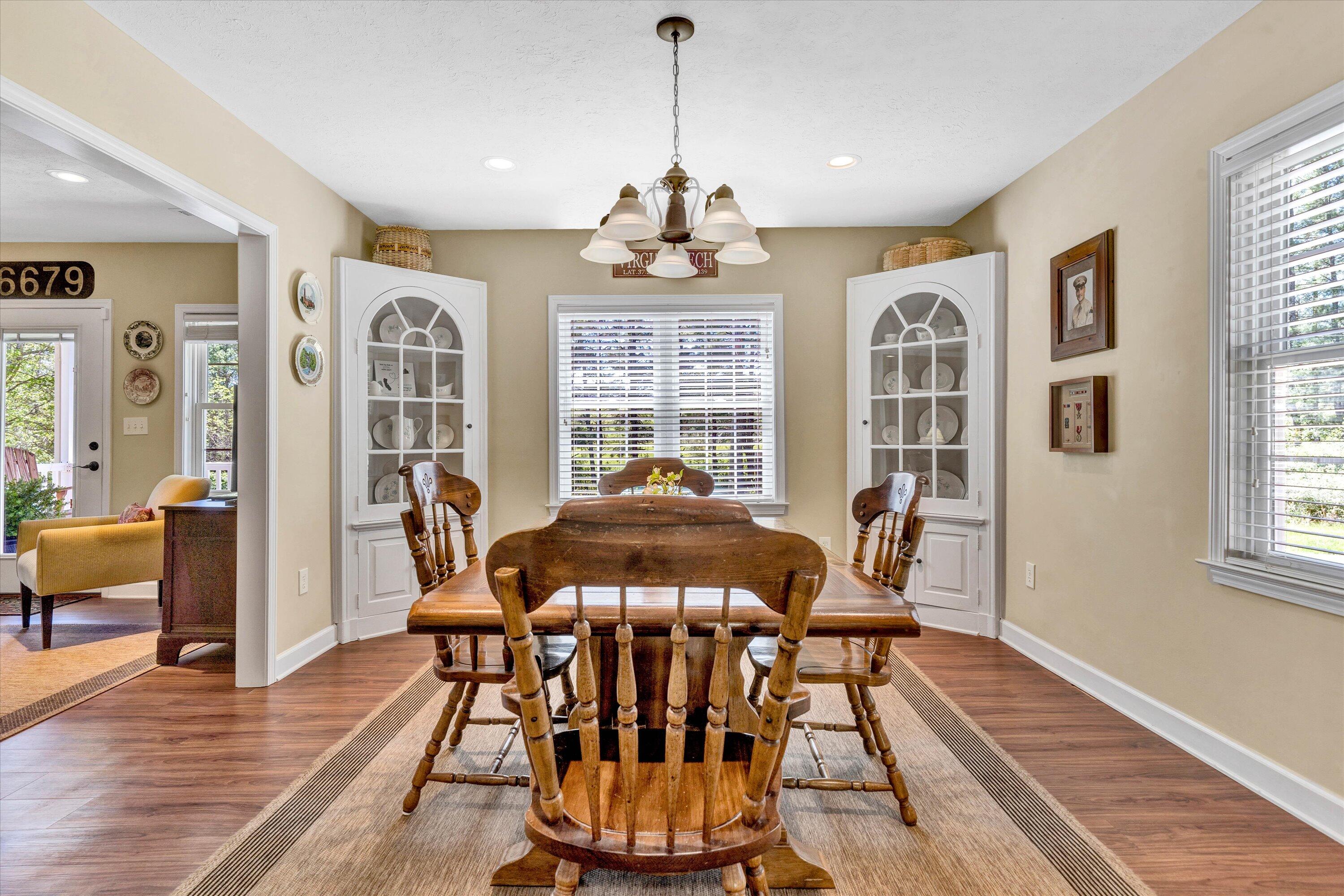 1186 Camp Jaycee Road Blue Ridge, VA 24064 - Photo 12 of 54 a view of a dining room with furniture window and wooden floor