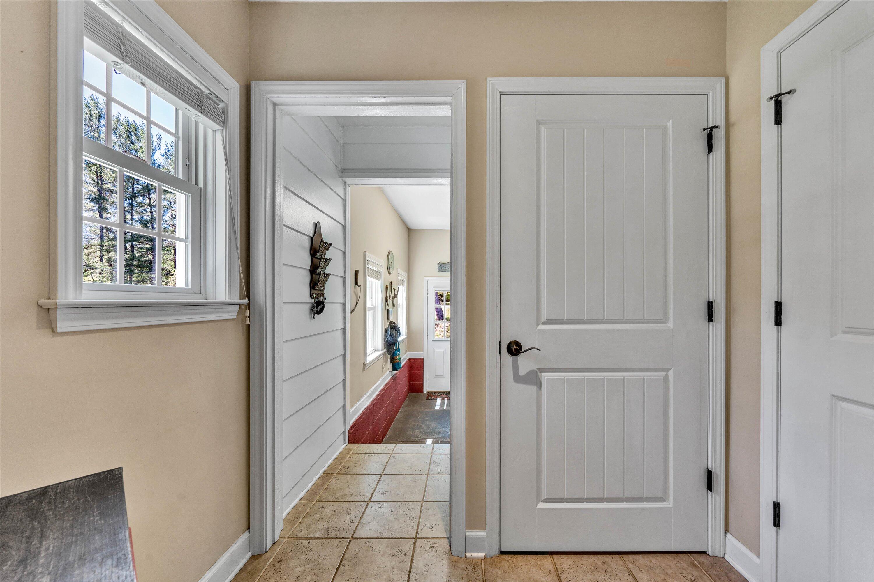 1186 Camp Jaycee Road Blue Ridge, VA 24064 - Photo 19 of 54 a view of an entryway with wooden floor and a livingroom