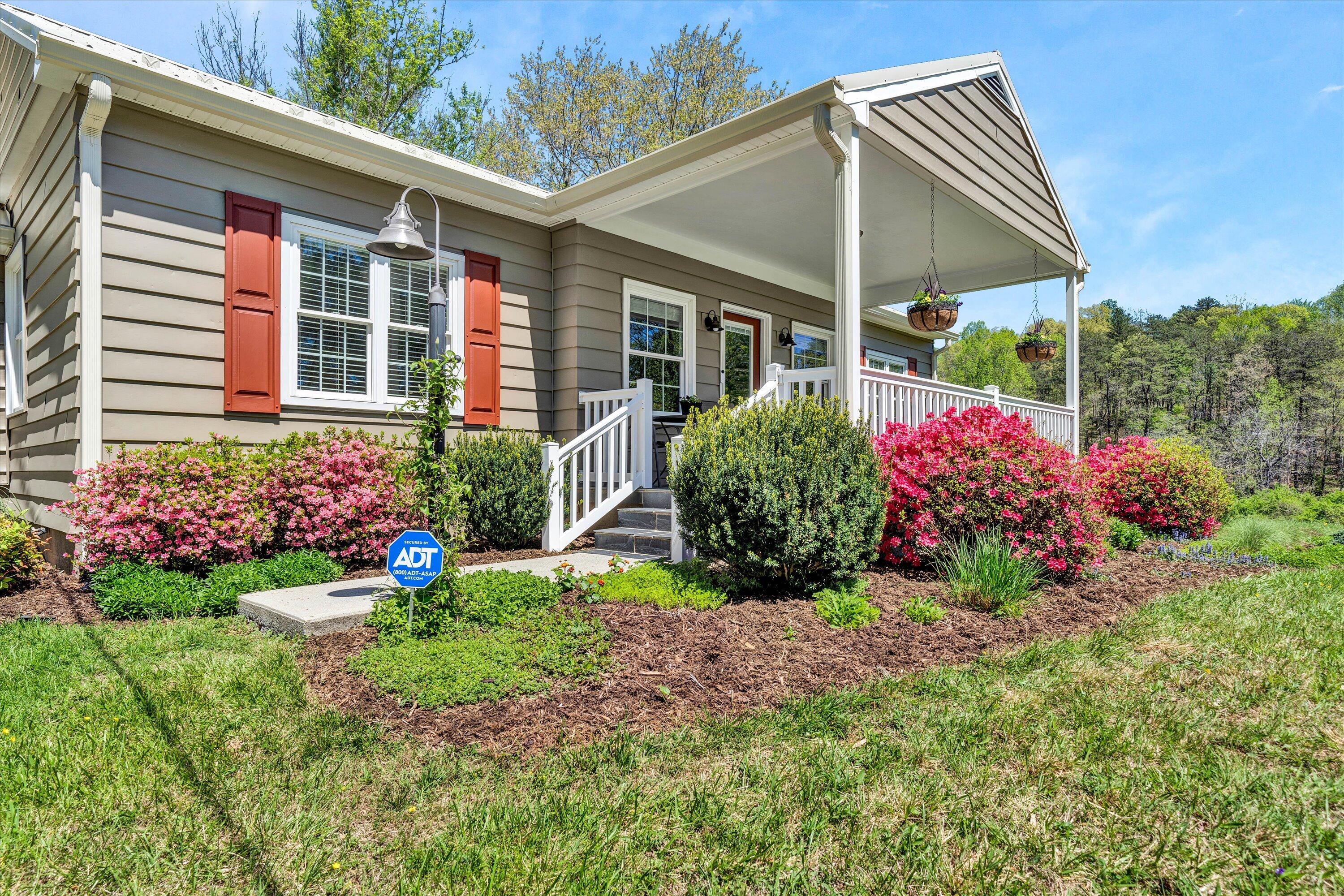 1186 Camp Jaycee Road Blue Ridge, VA 24064 - Photo 2 of 54 a view of a house with a backyard and garden
