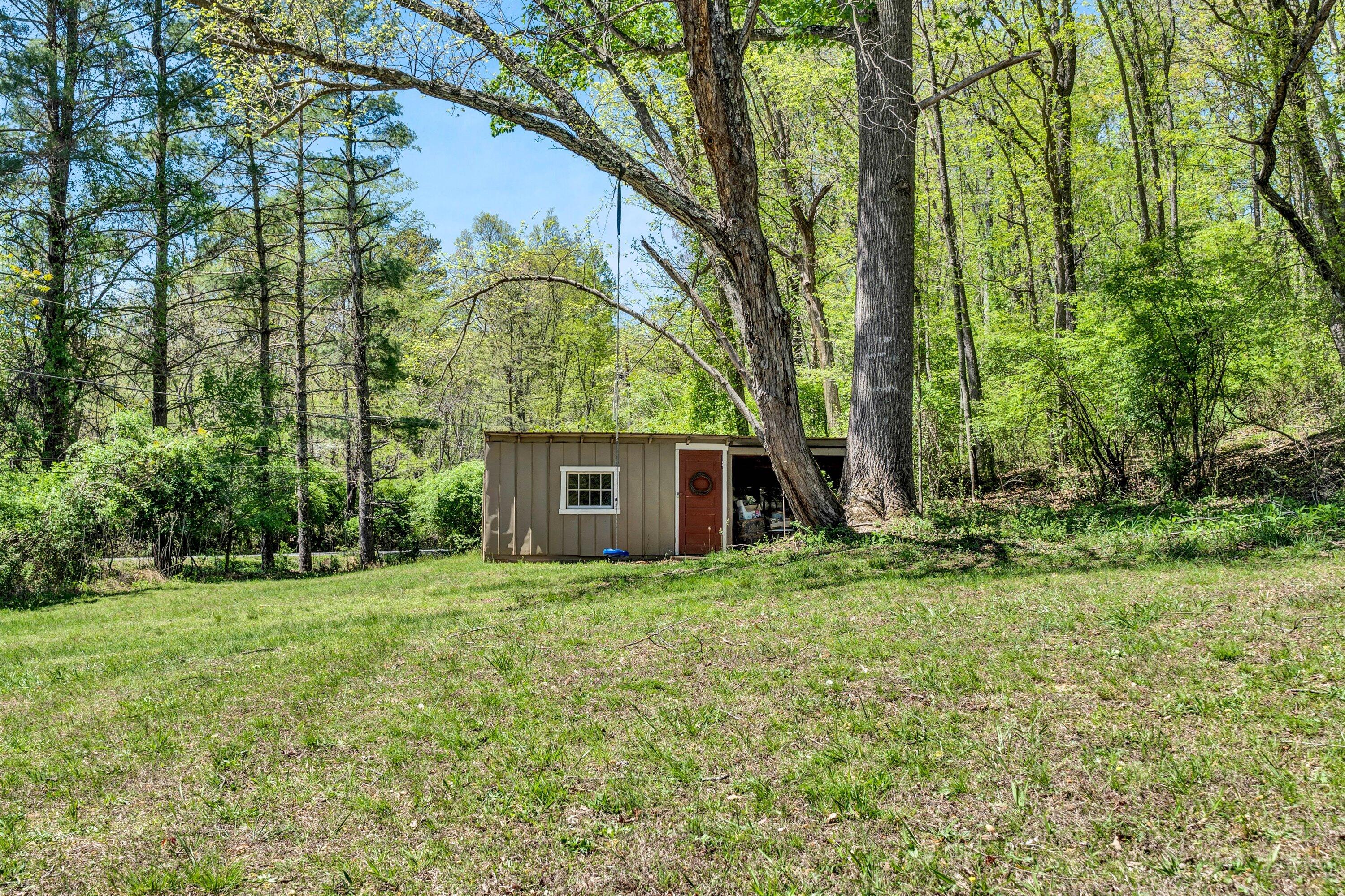 1186 Camp Jaycee Road Blue Ridge, VA 24064 - Photo 45 of 54 a view of a house with a yard