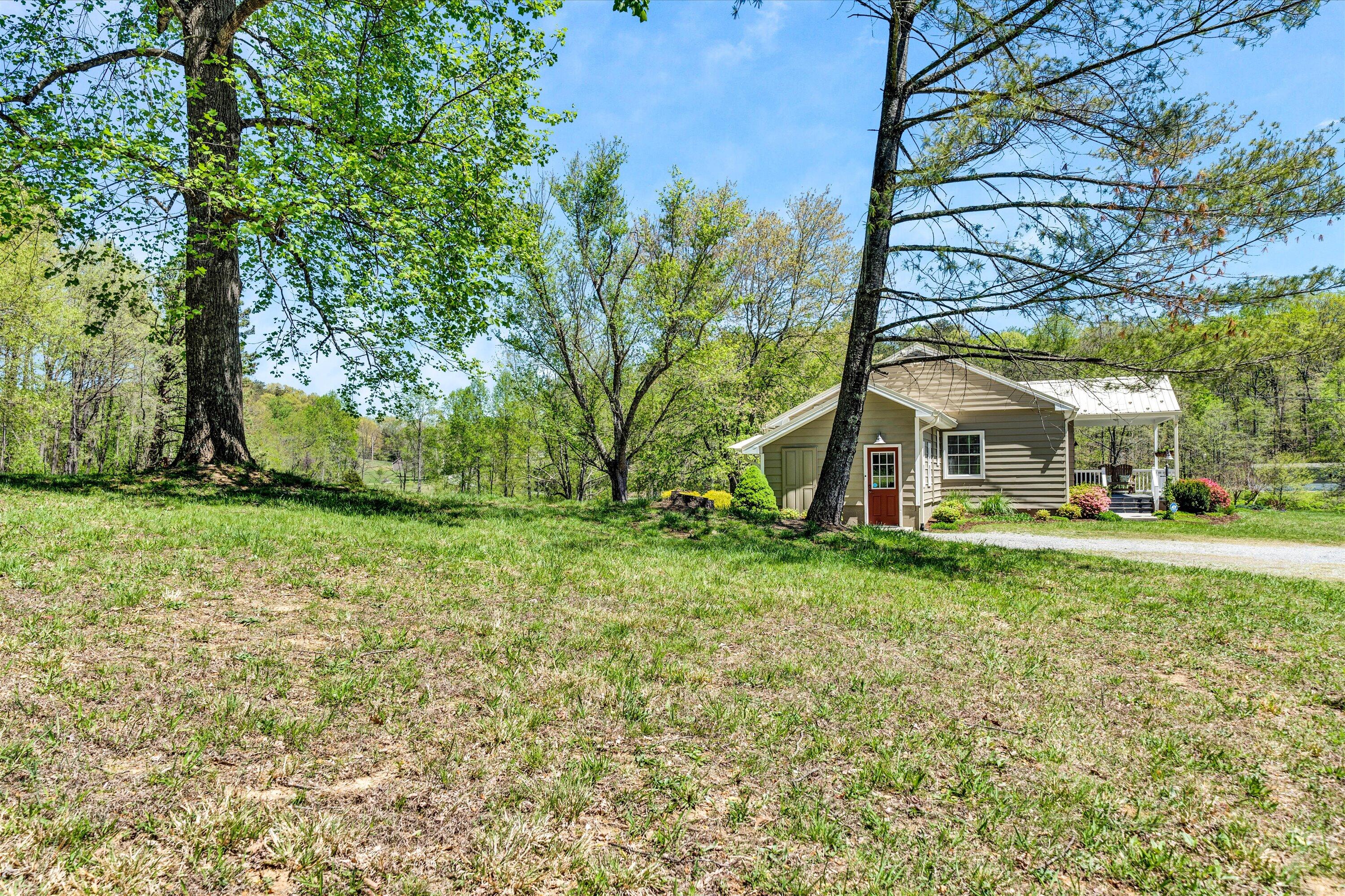 1186 Camp Jaycee Road Blue Ridge, VA 24064 - Photo 46 of 54 front view of a house with a yard