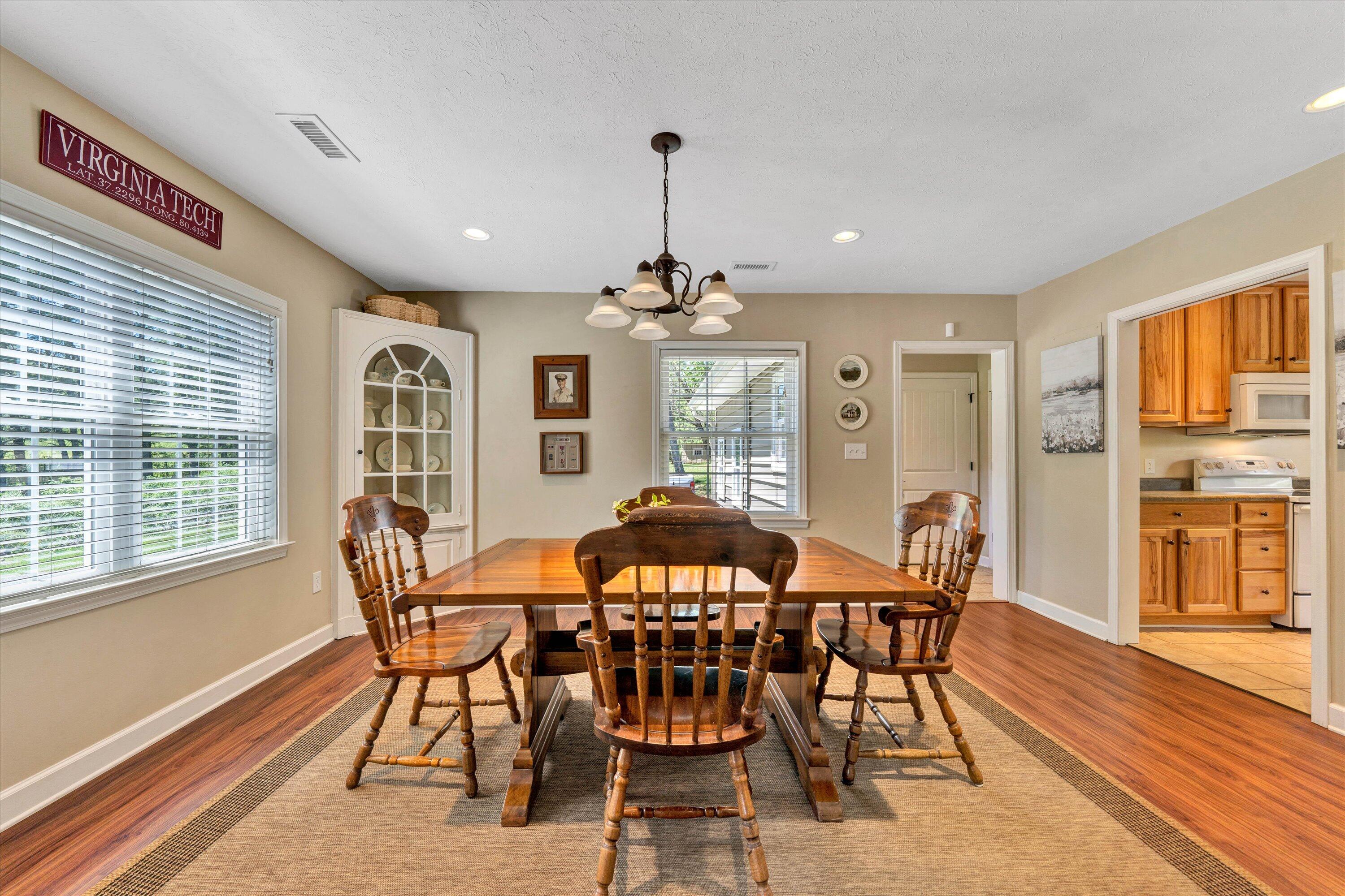 1186 Camp Jaycee Road Blue Ridge, VA 24064 - Photo 10 of 54 a view of a dining room with furniture window and wooden floor