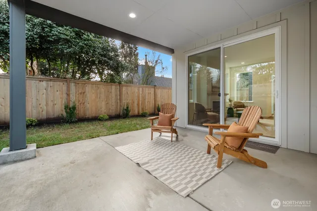a living room filled with furniture and a yard