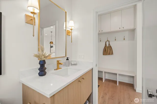 a bathroom with a sink and a mirror