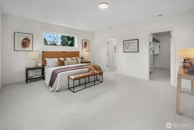 a bed room with a bed and a night stand