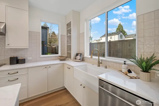 a kitchen with a sink and cabinets