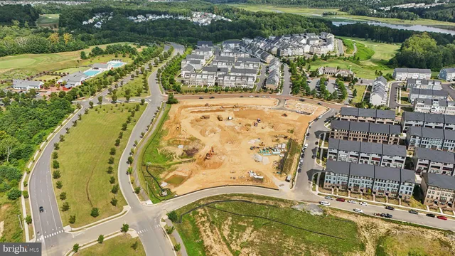 a living room with furniture large window and wooden floor