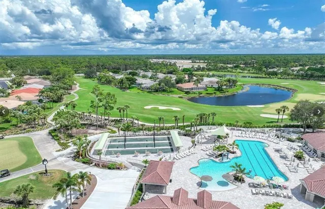 a view of a house with a tub and trees in the background