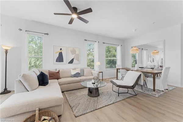 a bedroom with furniture and a wooden floor