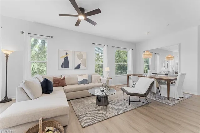 a bedroom with furniture and a wooden floor