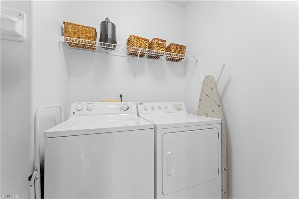 8217 Parkstone Place, Unit 308 Naples, FL 34120 - Photo 20 of 50 a utility room with dryer and washer