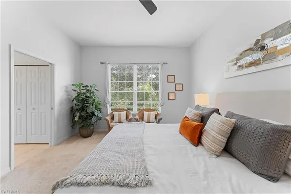 a spacious bathroom with a shower a sink and mirror
