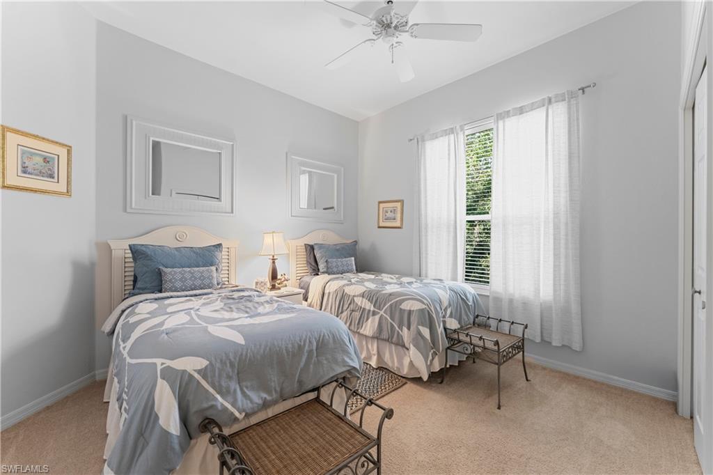 8217 Parkstone Place, Unit 308 Naples, FL 34120 - Photo 29 of 50 a bedroom with two beds and windows