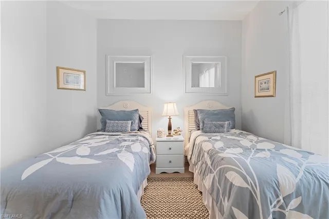 a dining room with furniture water view and a large window