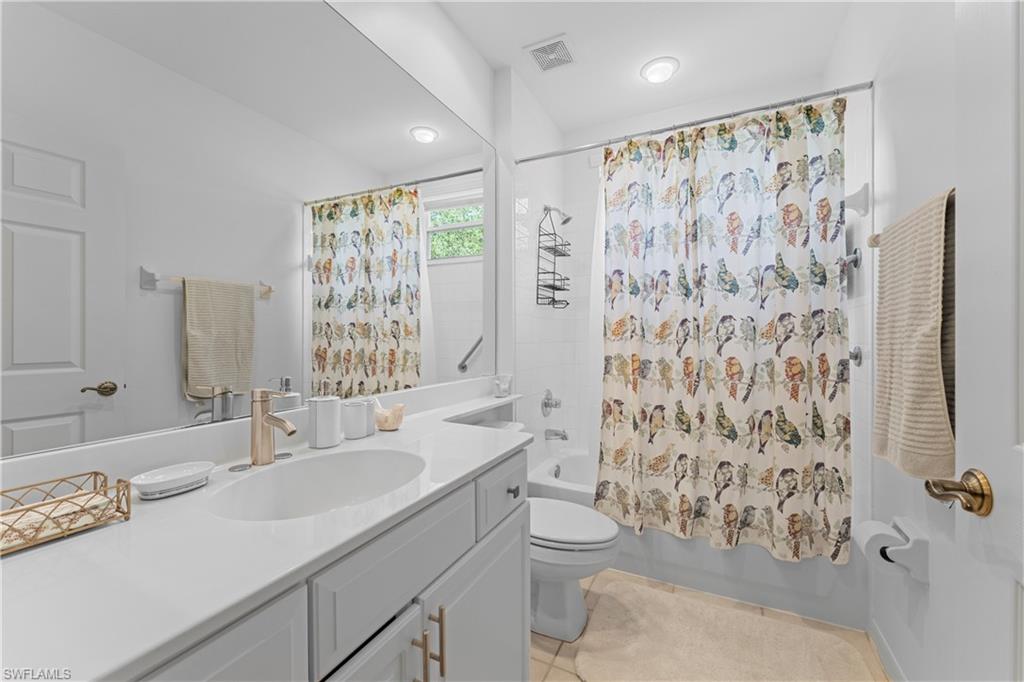 8217 Parkstone Place, Unit 308 Naples, FL 34120 - Photo 31 of 50 a bathroom with a sink toilet and shower