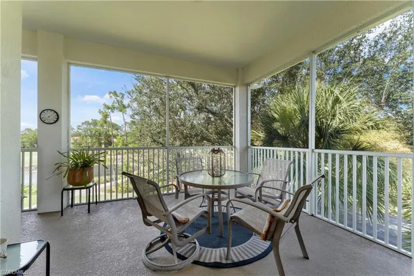 a view of balcony with furniture