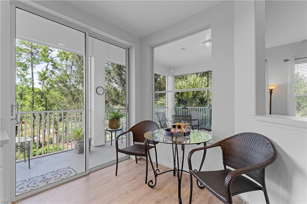 8217 Parkstone Place, Unit 308 Naples, FL 34120 - Photo 34 of 50 a dining room with furniture window and outside view