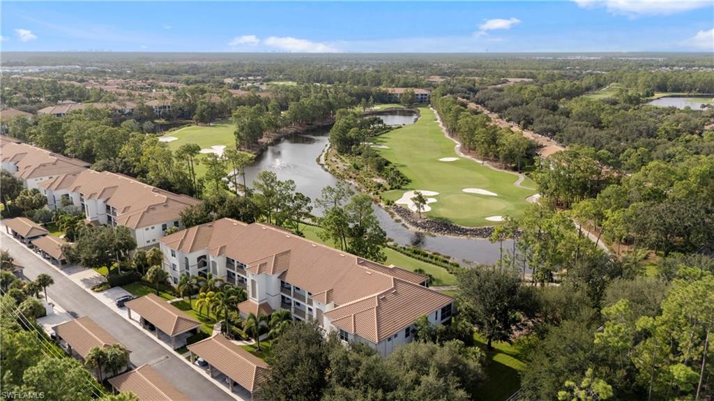 8217 Parkstone Place, Unit 308 Naples, FL 34120 - Photo 36 of 50 an aerial view of lake residential house with swimming pool and green space
