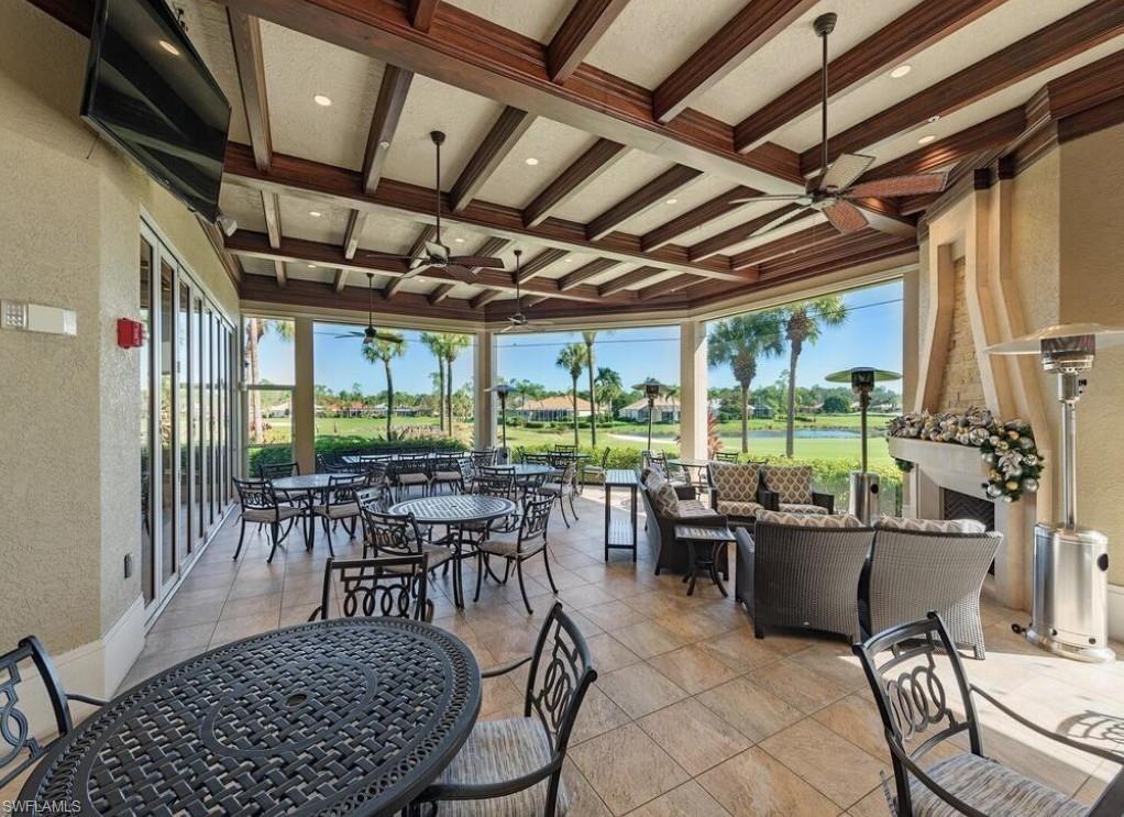8217 Parkstone Place, Unit 308 Naples, FL 34120 - Photo 43 of 50 a outdoor space with lots of tables and chairs