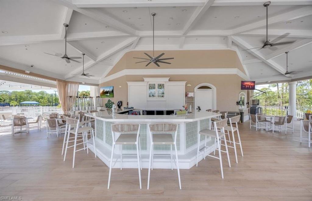 8217 Parkstone Place, Unit 308 Naples, FL 34120 - Photo 50 of 50 a view of a dining room with furniture window and outside view