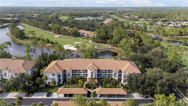an aerial view of a house with a garden and mountain view