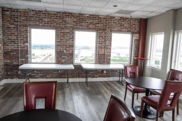 a dining room with furniture and windows
