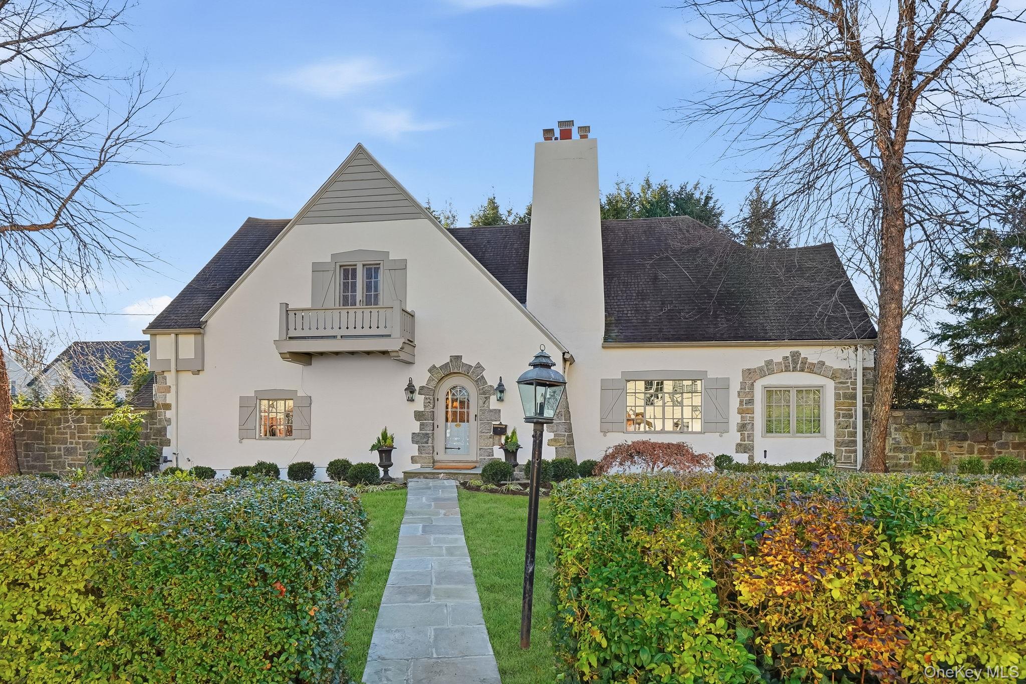 1 Oneida Street Rye, NY 10580 - Photo 1 of 32 a front view of a house with garden