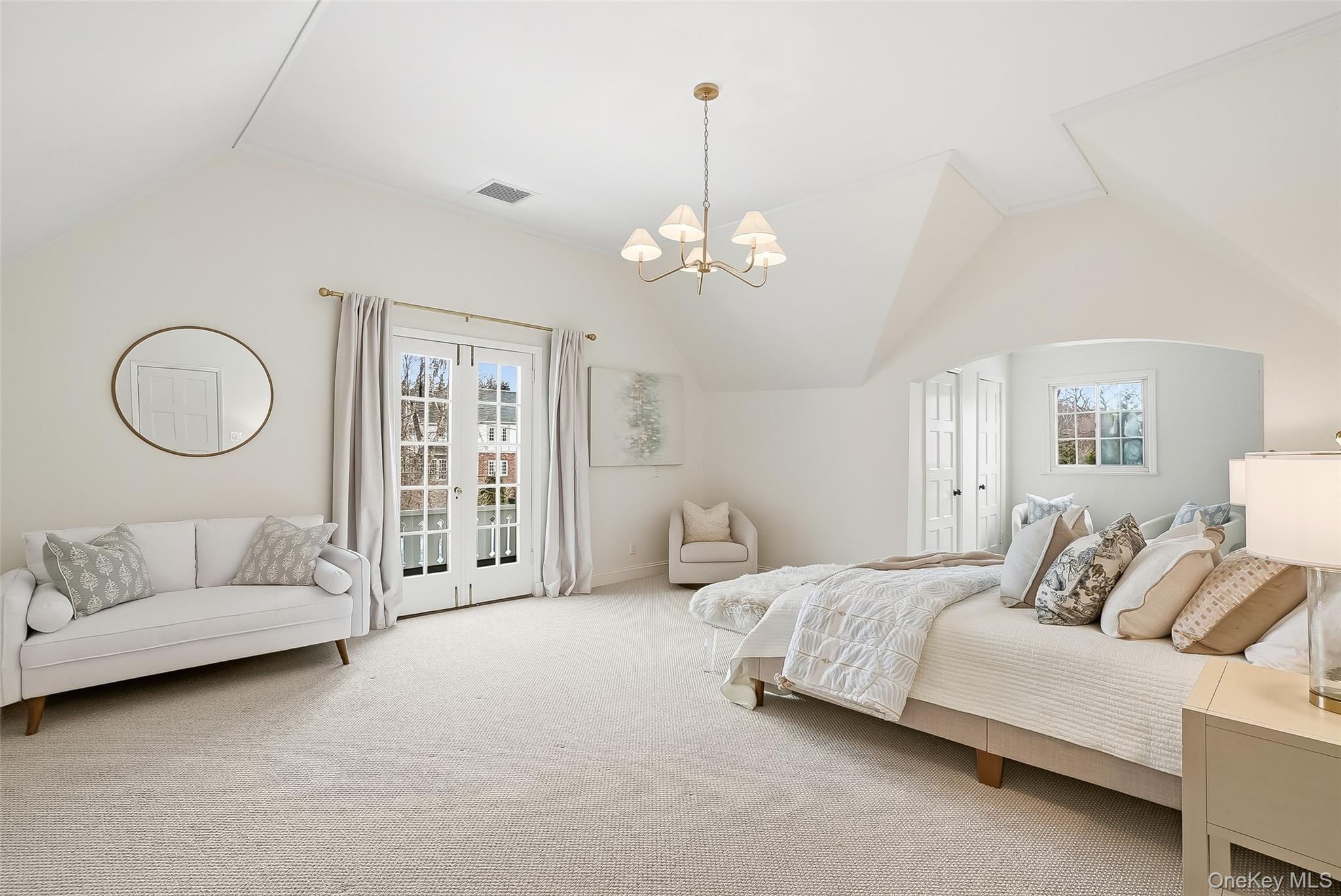 1 Oneida Street Rye, NY 10580 - Photo 17 of 32 a spacious bedroom with bed and a chandelier