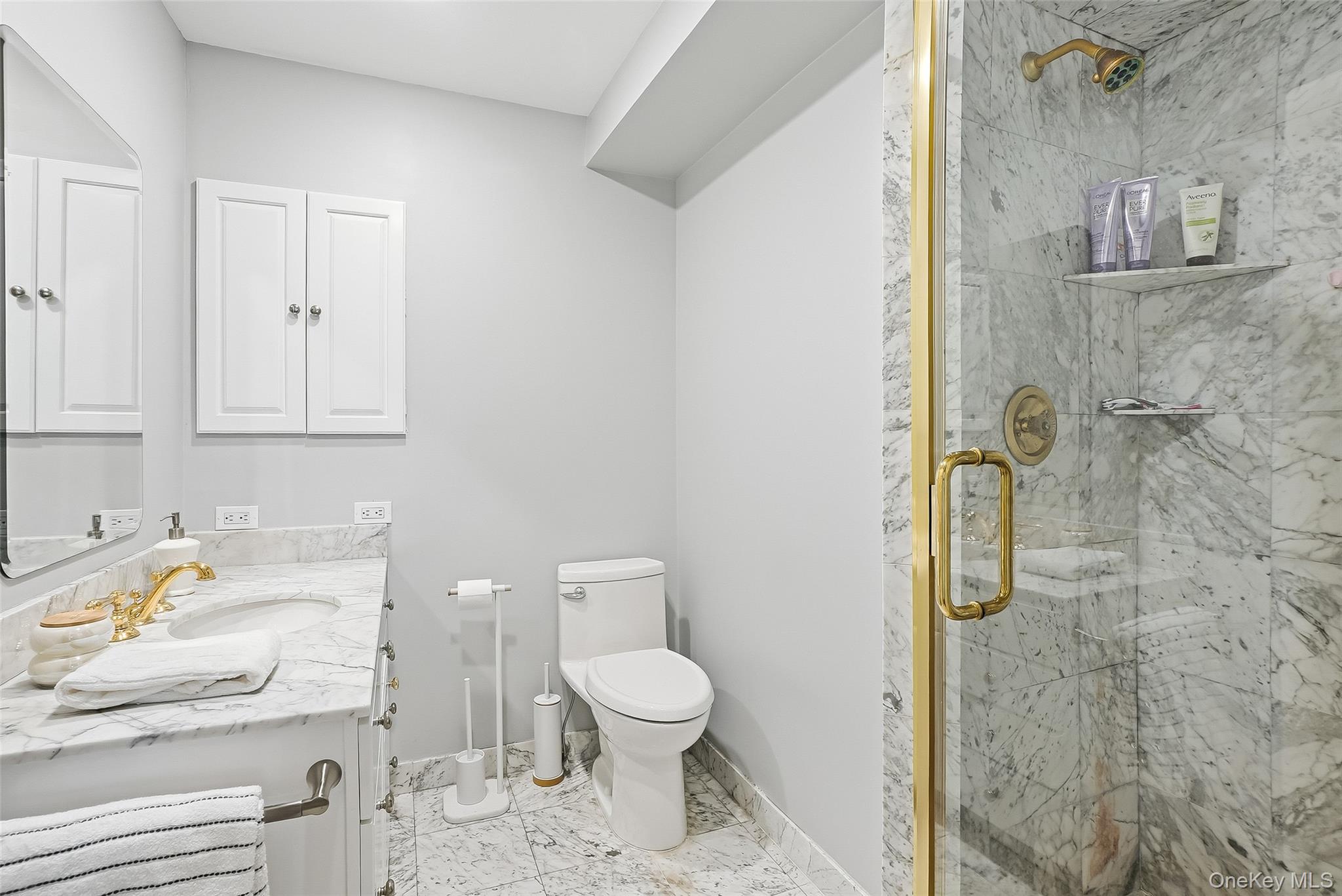 1 Oneida Street Rye, NY 10580 - Photo 22 of 32 a bathroom with a granite countertop sink toilet and shower