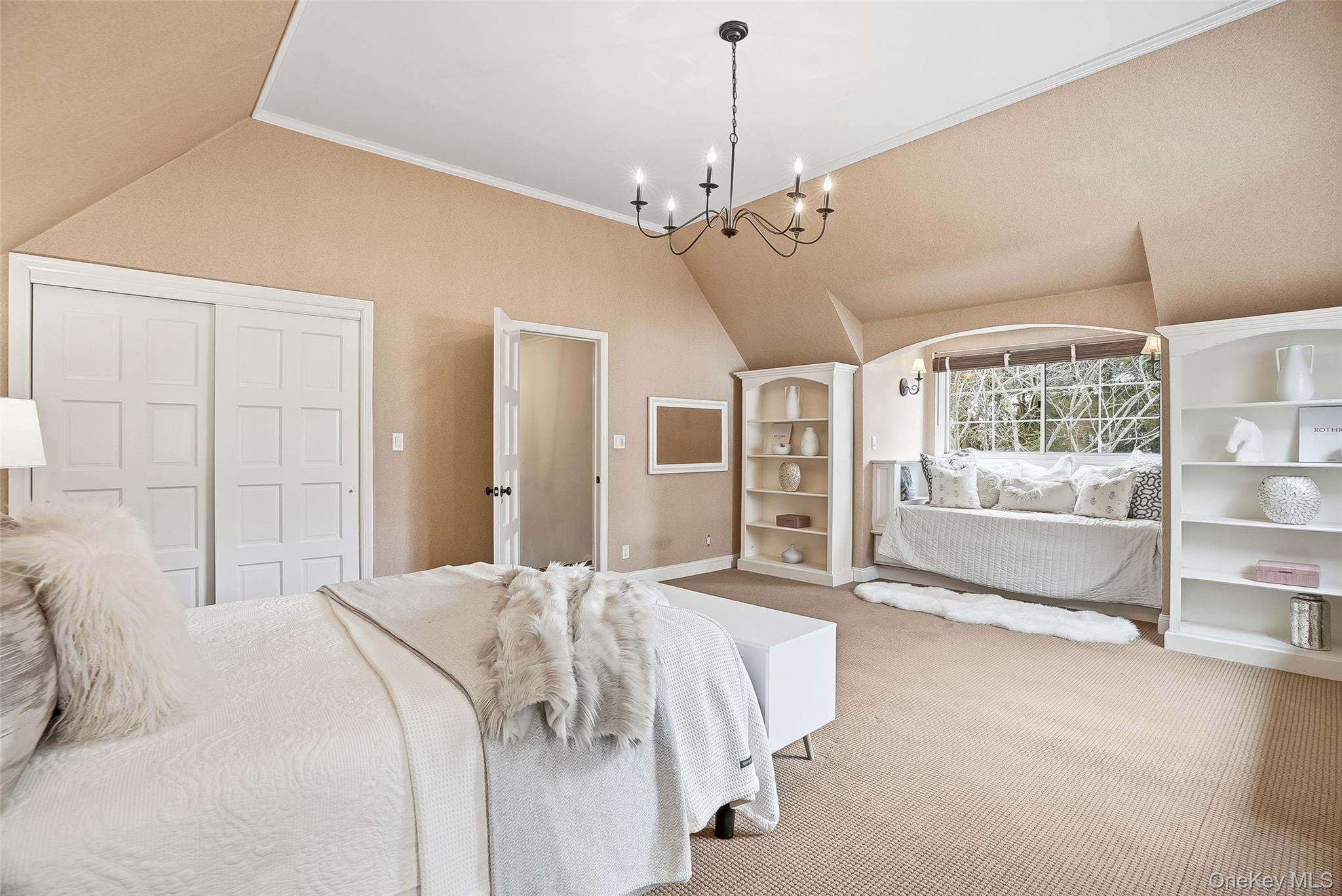 1 Oneida Street Rye, NY 10580 - Photo 23 of 32 a spacious bedroom with a bed chandelier and window