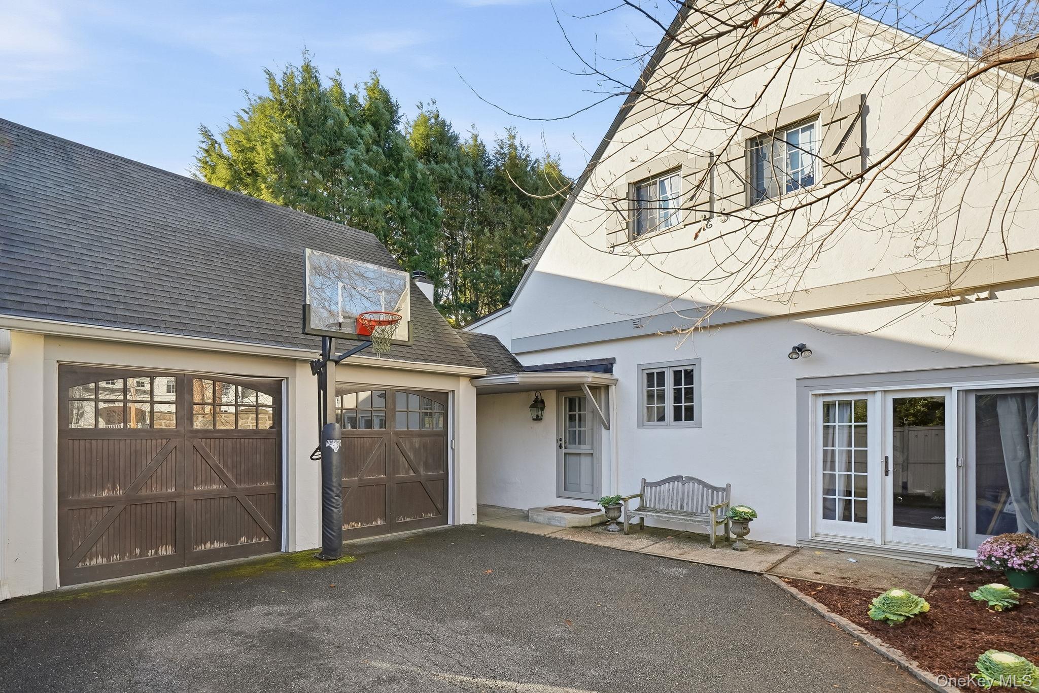 1 Oneida Street Rye, NY 10580 - Photo 27 of 32 front view of a house with a garage