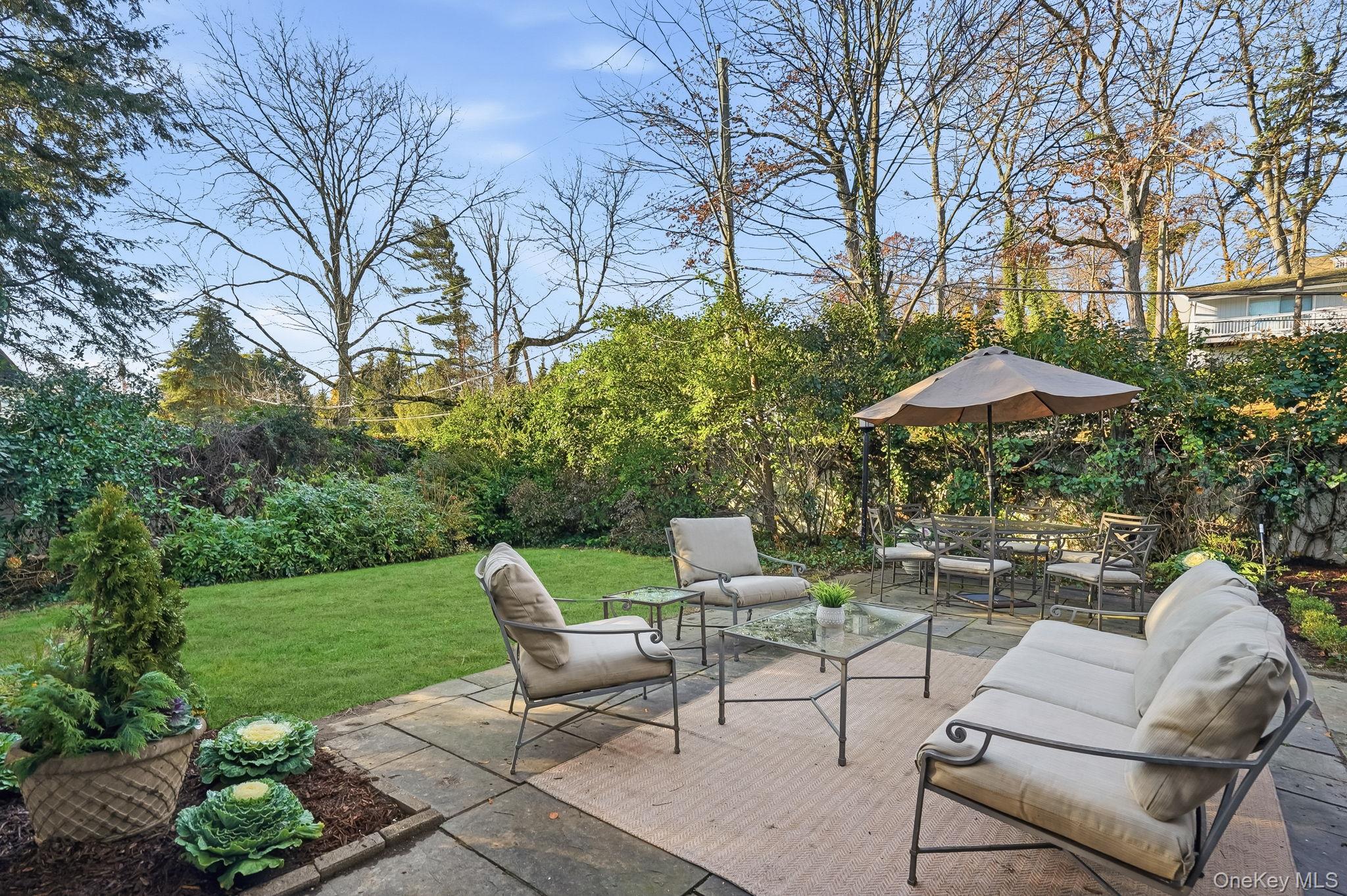 1 Oneida Street Rye, NY 10580 - Photo 7 of 32 a view of backyard with outdoor seating and trees
