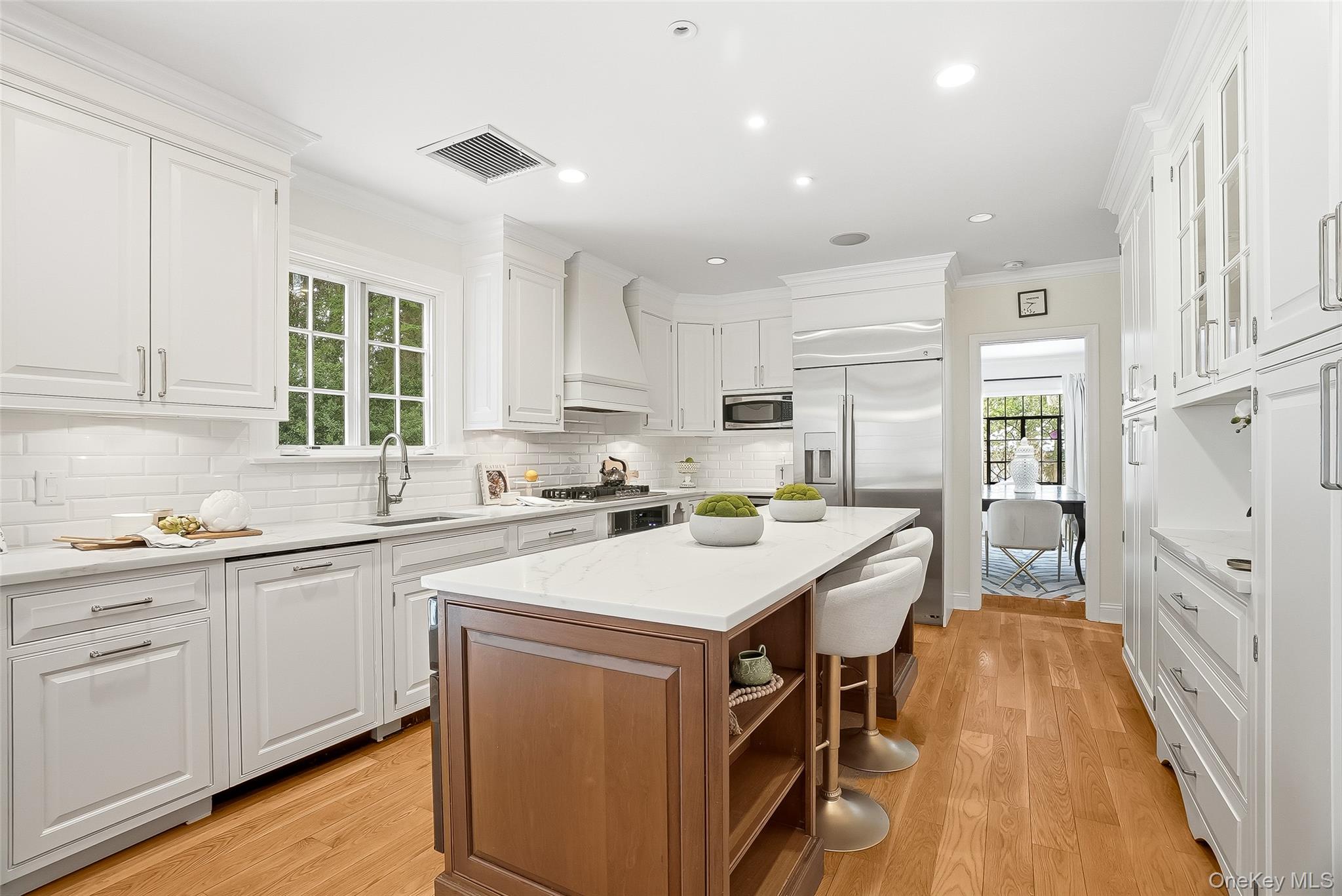 1 Oneida Street Rye, NY 10580 - Photo 9 of 32 a kitchen with a sink stove and cabinets