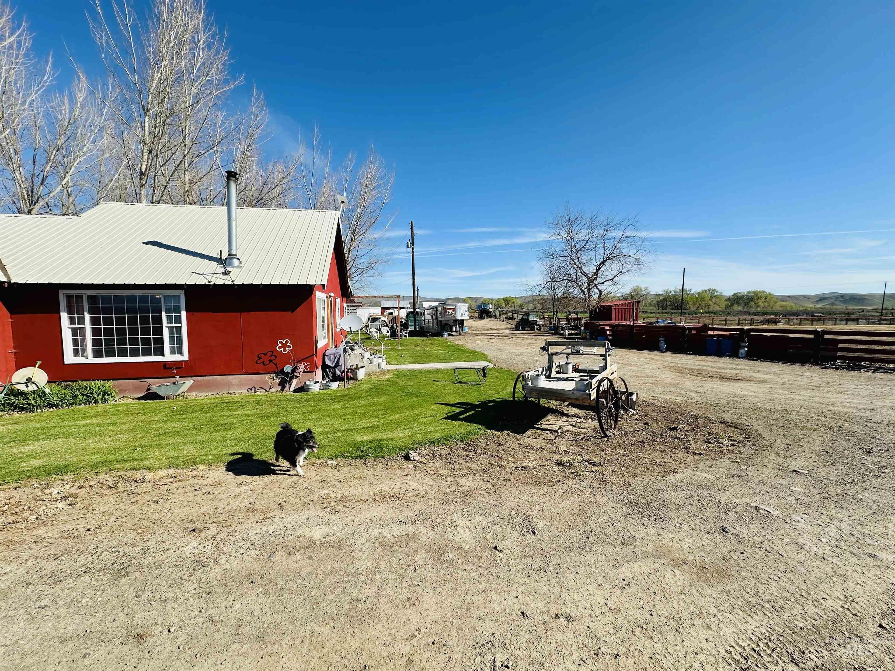 5051 South Rd J Vale, OR 97918 - Photo 32 of 49 View of home's exterior with a metal roof and a yard
