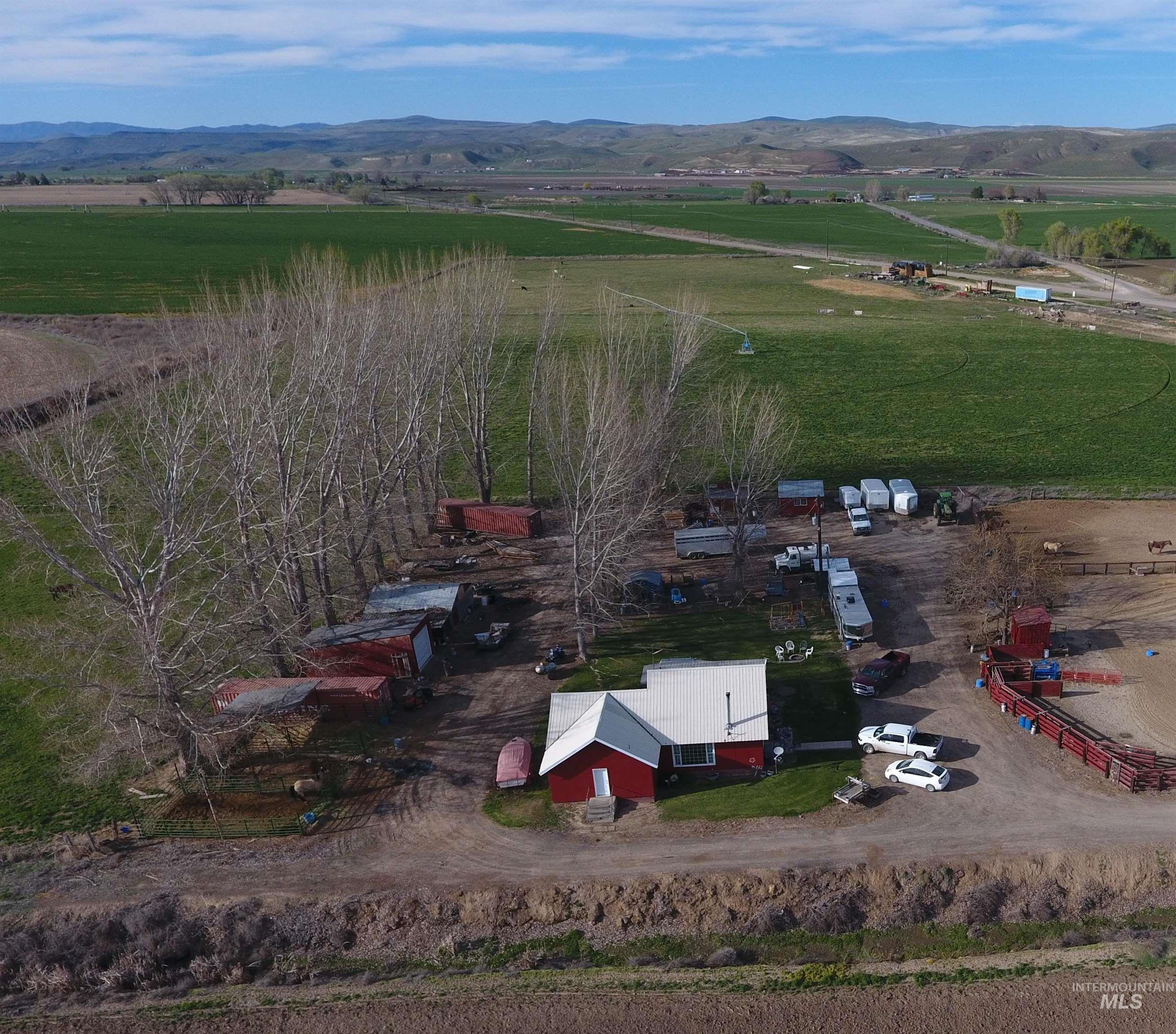 5051 South Rd J Vale, OR 97918 - Photo 37 of 49 Aerial view of sparsely populated area with a mountainous background and abundant farmland
