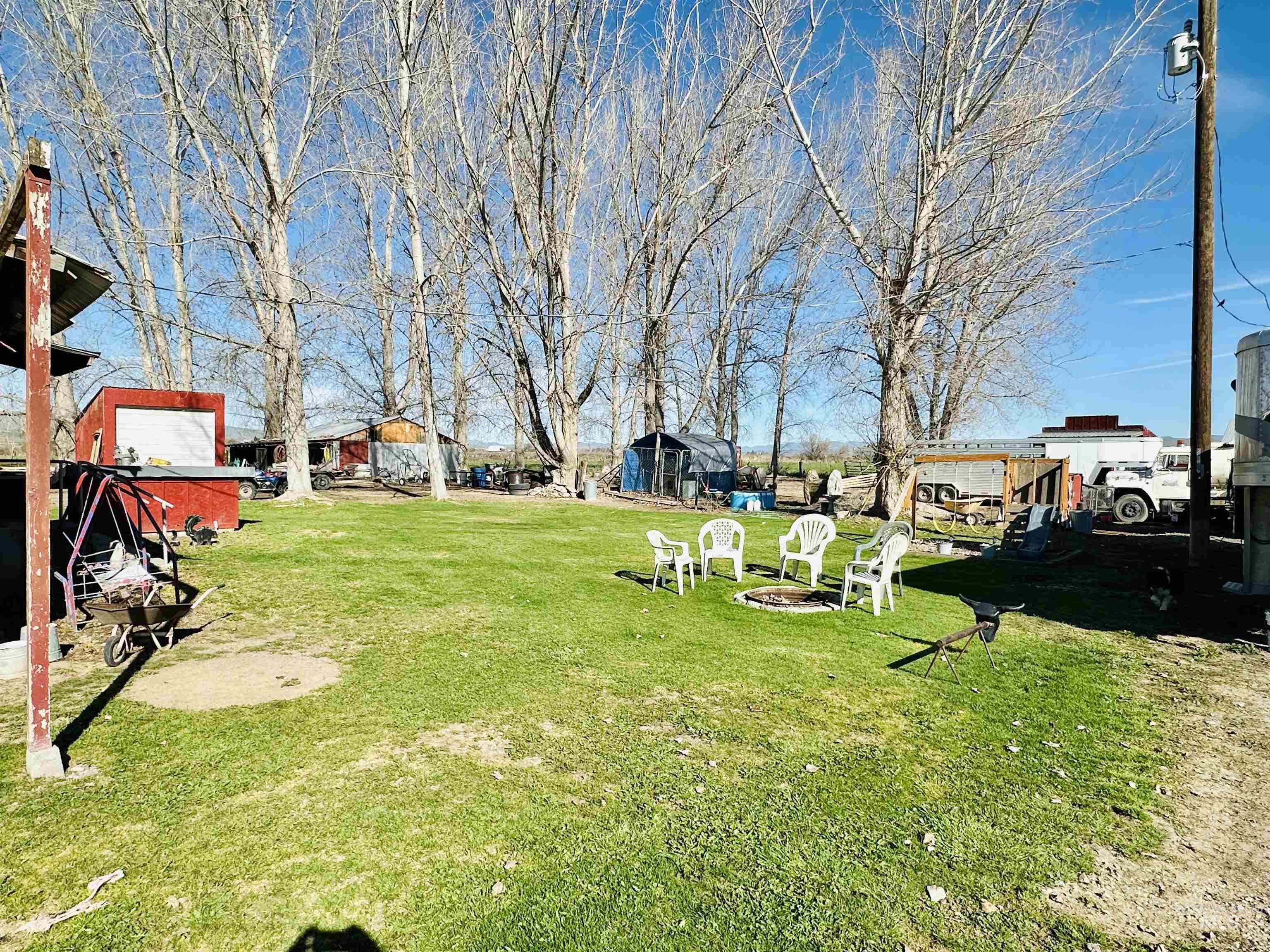 5051 South Rd J Vale, OR 97918 - Photo 49 of 49 View of grassy yard featuring a fire pit and an outdoor structure