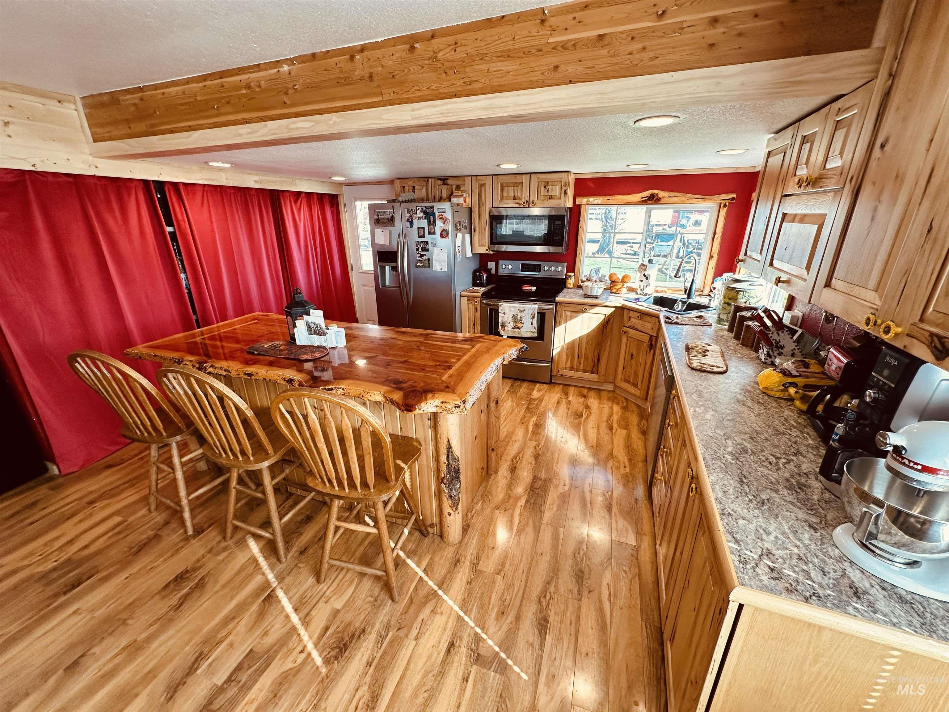 5051 South Rd J Vale, OR 97918 - Photo 5 of 49 Dining room featuring a textured ceiling and light wood-style floors