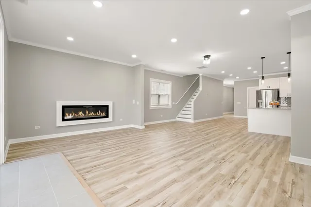 a view of a kitchen with a refrigerator and a window