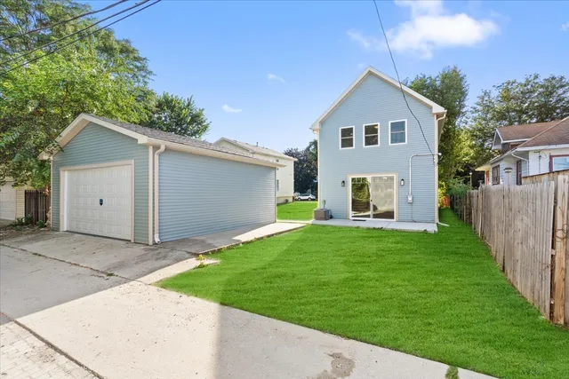 a view of an house with backyard space and garden