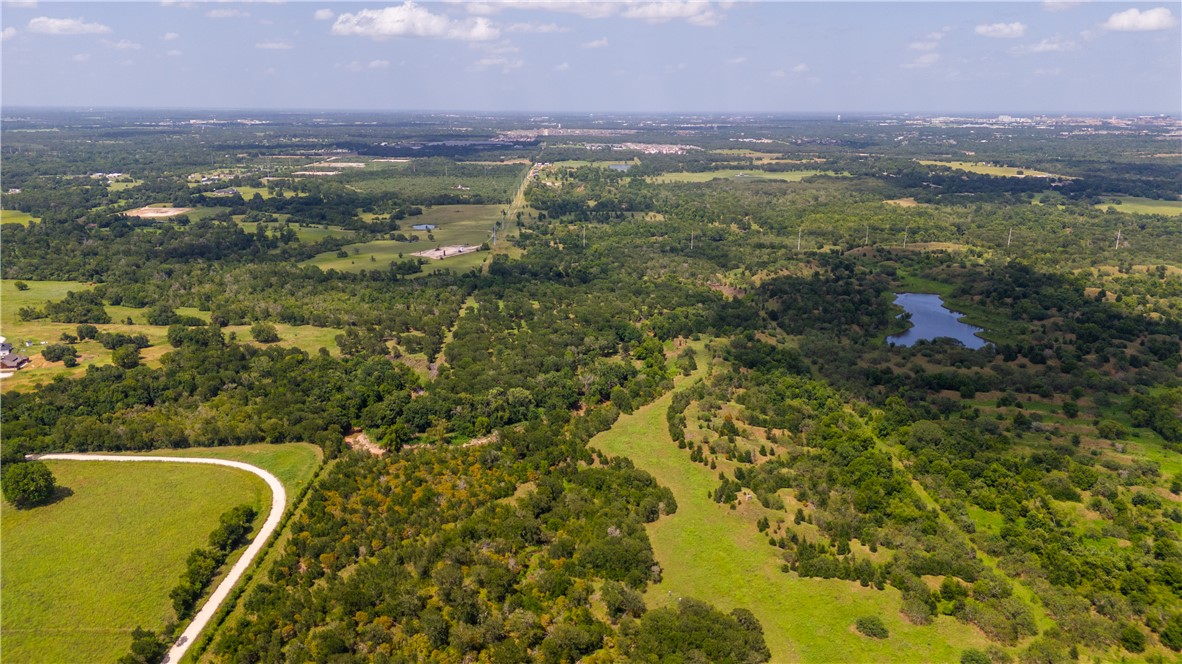 0 Leonard Road Bryan, TX 77807 - Photo 7 of 24 Bird's eye view of a heavily wooded area and a large body of water
