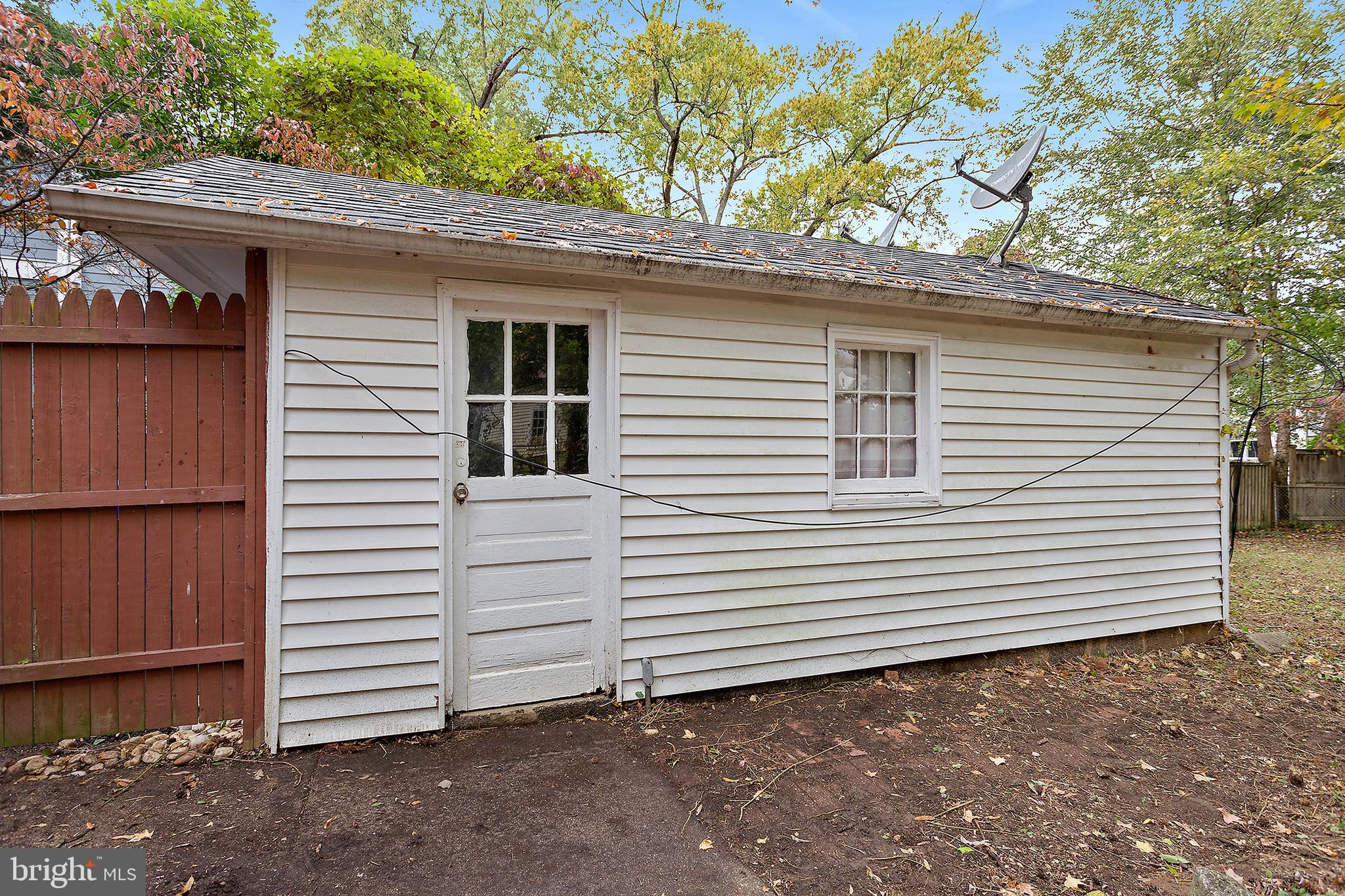 5913 Rolston Road Bethesda, MD 20817 - Photo 30 of 37 a view of a house with a yard and garage