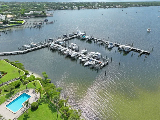 an aerial view of a houses with a lake view