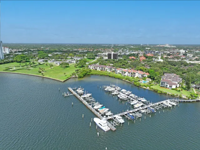 a view of a lake with a table and chairs