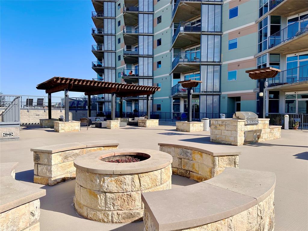 1001 Belleview Street, Unit 307 Dallas, TX 75215 - Photo 33 of 40 a swimming pool with outdoor seating and yard