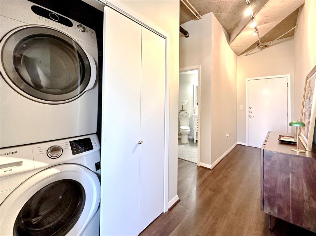 1001 Belleview Street, Unit 307 Dallas, TX 75215 - Photo 7 of 40 a view of a hallway with washer and dryer