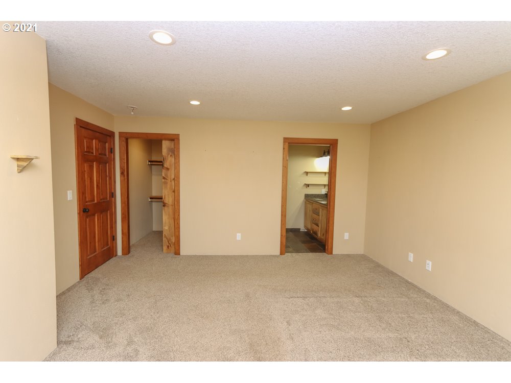 2090 Nielsen Road Tillamook, OR 97141 - Photo 22 of 29 a view of an empty room with window and bathroom